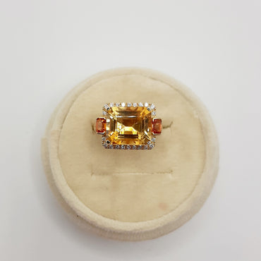 18kt yellow gold citrine ring featuring a 6.28 carats citrine and .18 carats of natural diamonds