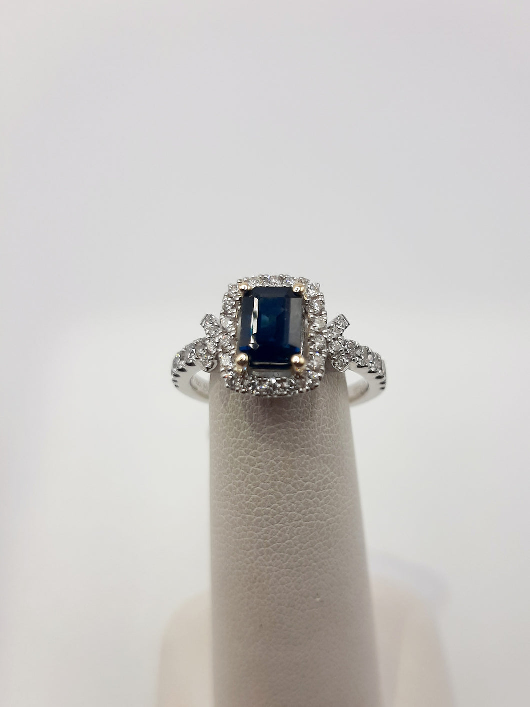 14kt white gold ring featuring a 1.10 carat Natural Sapphire and .54 carats of natural diamonds