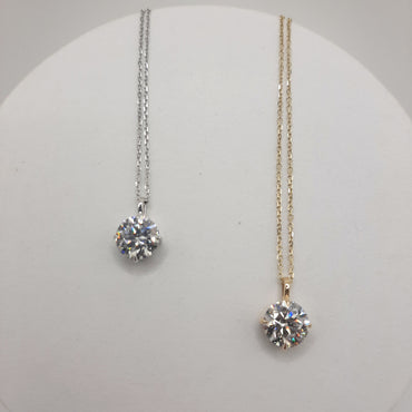 14kt white and yellow gold solitaire necklaces featuring 2.10 carats of lab grown diamonds on 18