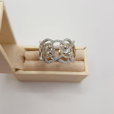 14kt white and yellow gold band featuring 1.0 carats of natural diamonds