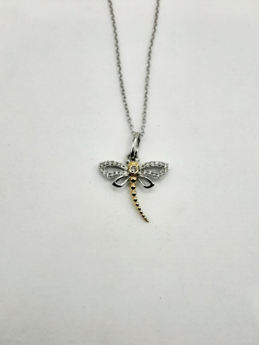 Sterling silver and 14kt yellow gold dragonfly pendant featuring .16 carats of natural diamonds 