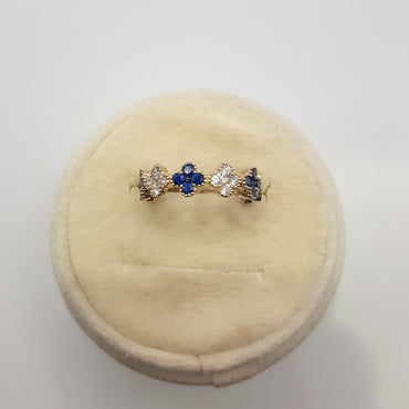 14kt yellow gold clover ring featuring .49 carats of sapphires and .26 carats of natural diamonds 