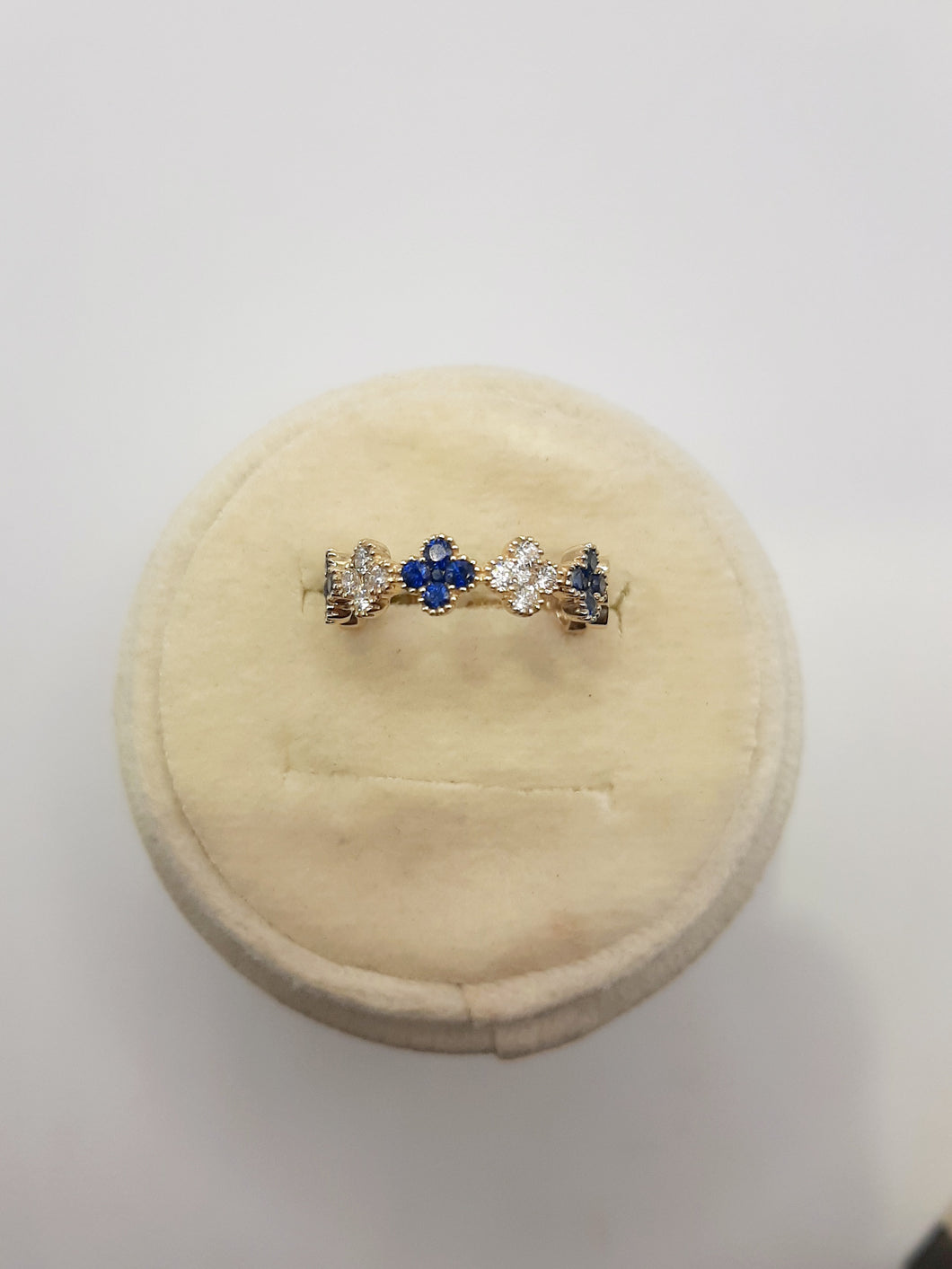 14kt yellow gold clover ring featuring .49 carats of sapphires and .26 carats of natural diamonds 