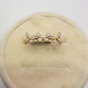 14kt yellow gold butterfly band featuring .15 carats of natural diamonds