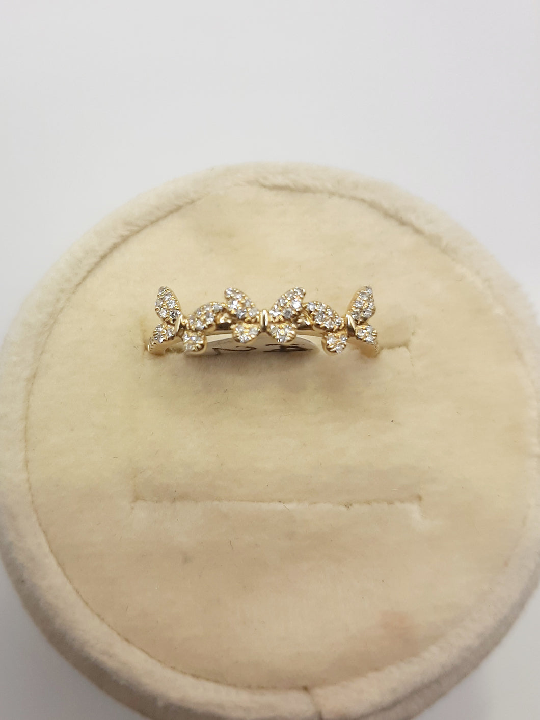 14kt yellow gold butterfly band featuring .15 carats of natural diamonds