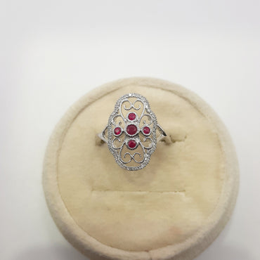 10kt white gold vintage ruby ring featuring natural rubies and diamonds