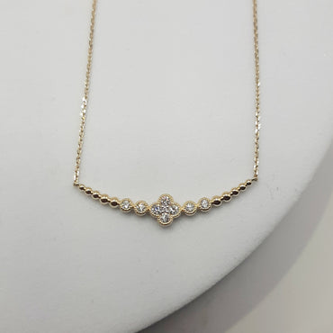 14Kt yellow gold clover necklace featuring .30 carats of natural diamonds