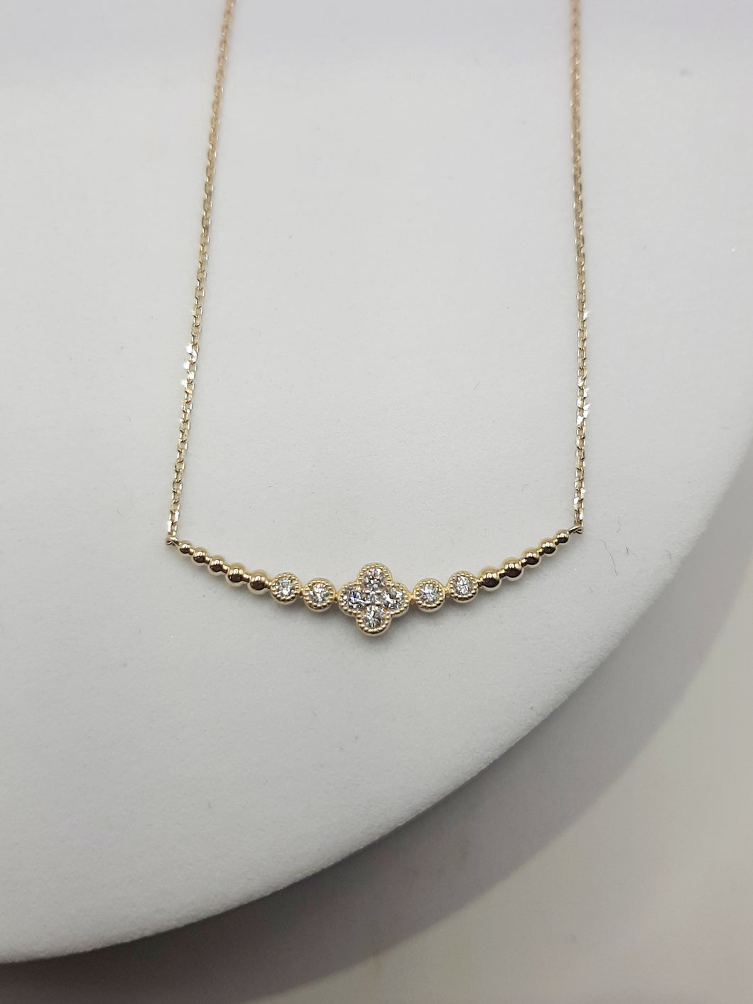 14Kt yellow gold clover necklace featuring .30 carats of natural diamonds