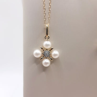 10kt yellow gold pearl and .03 carats of natural diamonds pendant