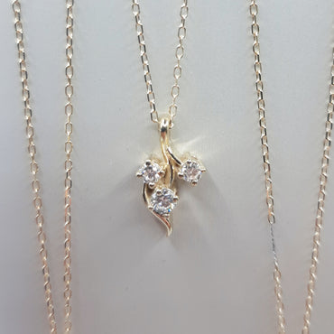 14kt yellow gold three stone diamond pendant