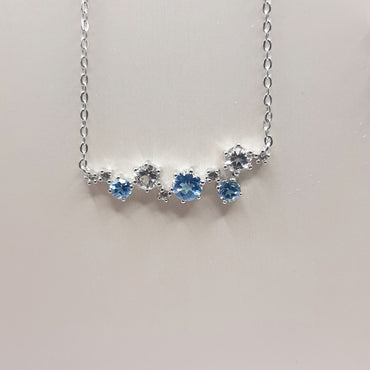 Sterling silver fashion trending necklace featuring white and blue topaz