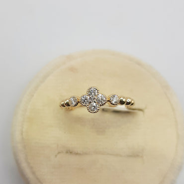 14kt yellow gold clover ring featuring .26 carats of natural diamonds
