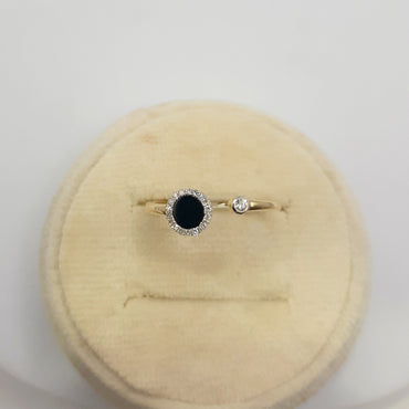 14kt yellow gold ring featuring .25 black onyx and .08 carats of natural diamonds