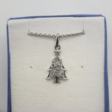 Sterling silver Christmas tree necklace featuring white and blue topaz