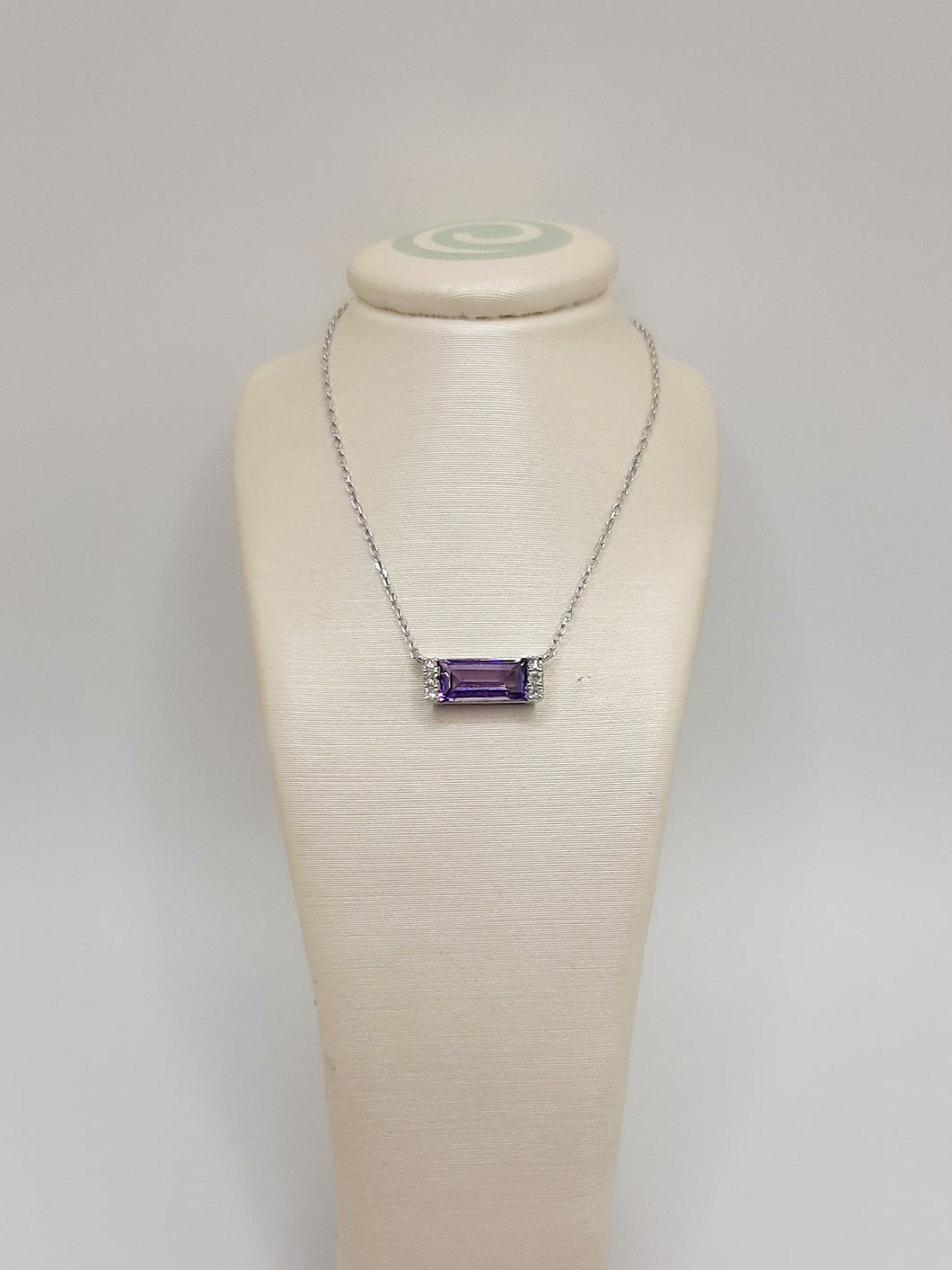 14kt white gold east to west necklace featuring .49 carats of amethyst and .03 carats of diamonds