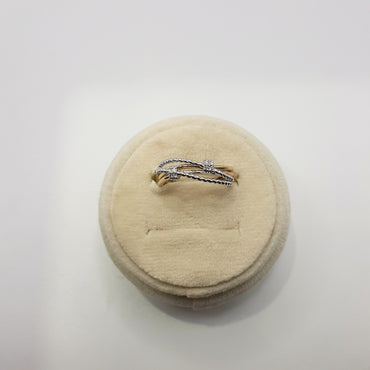 10kt white and yellow gold stack ring featuring .05 carats of natural diamonds