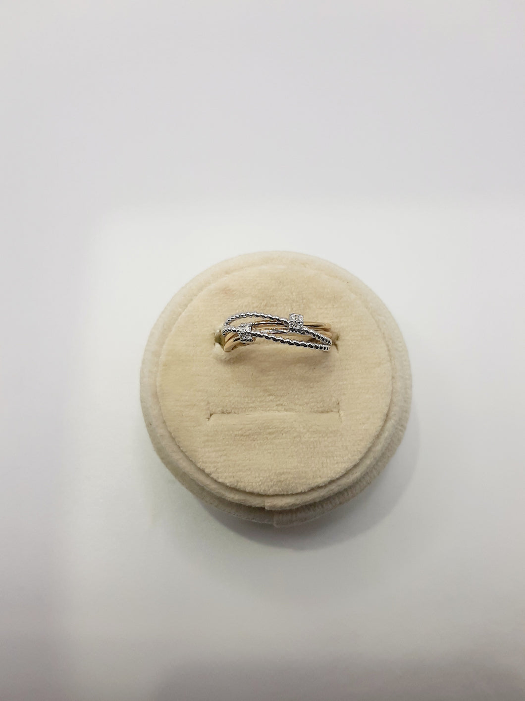 10kt white and yellow gold stack ring featuring .05 carats of natural diamonds