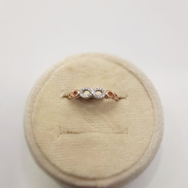 10kt white and rose gold featuring an infinity symbol with diamonds