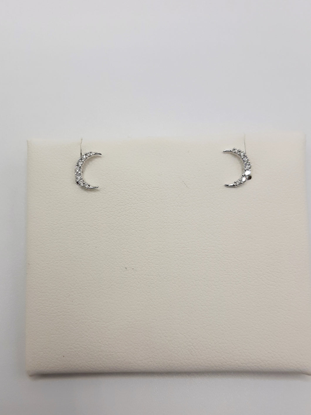 10kt white moon earring featuring .12 carats of natural diamonds