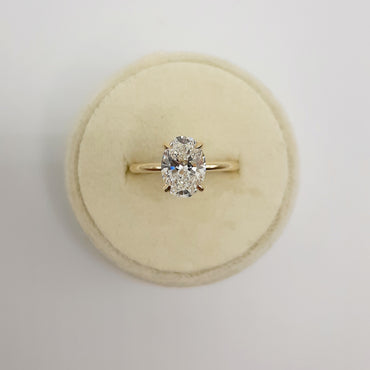 14kt Yellow Gold Four Prong 2.0 carat Oval Cut Lab Grown Diamond with a Hidden Halo Ring