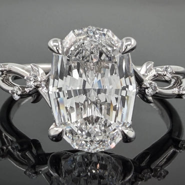 14kt white gold step cut oval lab diamond with a vine shank ring