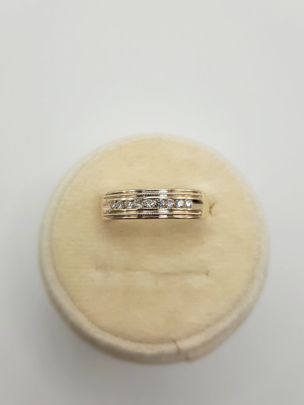 10Kt Yellow Gold Channel Band with Beaded Edges Featuring .26 Carats of Diamonds