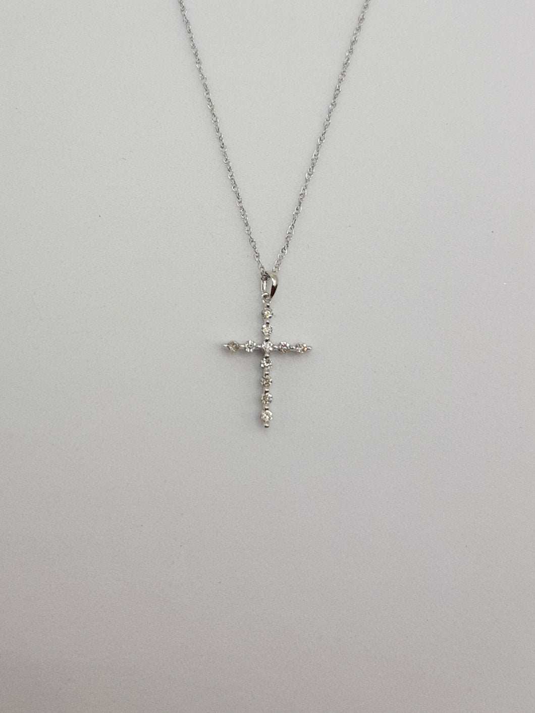 10Kt White Gold Cross Featuring .11 Carats of Natural Diamonds on 20