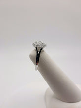Load image into Gallery viewer, 14Kt White Gold Double Halo Ring Featuring a .52 Carats Oval Solitaire and .19 Carats of Round Brilliant Cut Diamonds
