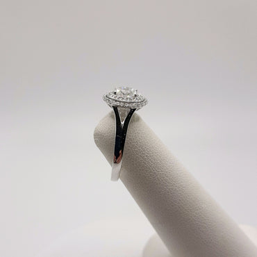 14Kt White Gold Double Halo Ring Featuring a .52 Carats Oval Solitaire and .19 Carats of Round Brilliant Cut Diamonds