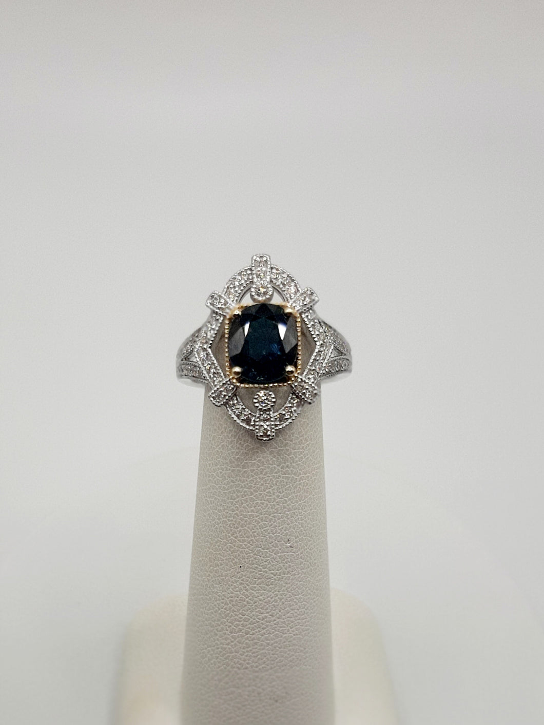 14Kt White and Yellow Gold Vintage Vibe Ring Featuring a 2.04 Carat Oval Blue Sapphire and .37 Carats of Diamonds