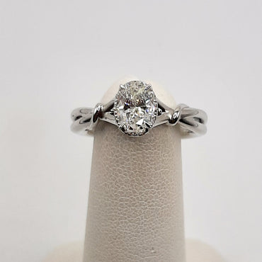 14Kt White Gold Solitaire Ring Featuring a .83 Carat Oval Diamond