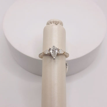 14Kt Yellow Gold Engagement Ring Featuring a .59 Center Pear Shape Flanked by 2 Pear Shapes on Either Side that weigh .33 Carats and .14 Carats of Rounds on Either Side