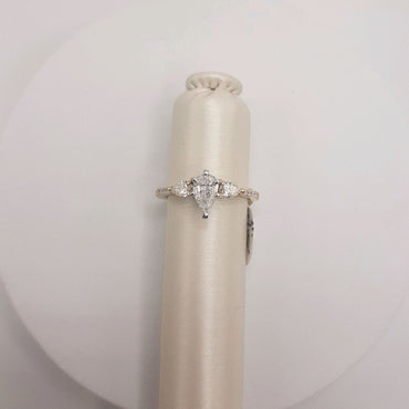 14Kt Yellow Gold Engagement Ring Featuring a .59 Center Pear Shape Flanked by 2 Pear Shapes on Either Side that weigh .33 Carats and .14 Carats of Rounds on Either Side