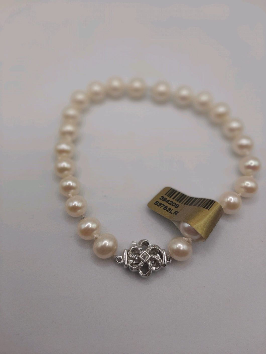 Sterling Silver Pearl Bracelet Featuring a .11 Carats Diamond Clasp