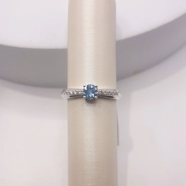 10Kt White Gold Fashion Ring Featuring a Swiss Blue Topaz and Diamonds