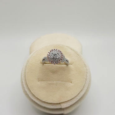 14Kt Two Tone Engagement Ring Featuring A .30 Carat Round Brilliant Cut Center Diamond Surrounded By A Double Halo Featuring 1/3 Carts of Natural Pink Diamonds and .15 Carats of Natural White Diamonds.