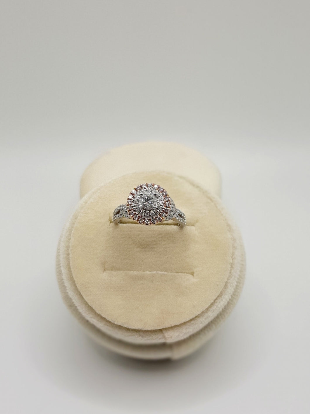 14Kt Two Tone Engagement Ring Featuring A .30 Carat Round Brilliant Cut Center Diamond Surrounded By A Double Halo Featuring 1/3 Carts of Natural Pink Diamonds and .15 Carats of Natural White Diamonds.