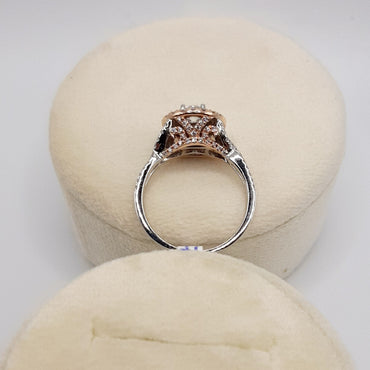 14Kt Two Tone Engagement Ring Featuring A .30 Carat Round Brilliant Cut Center Diamond Surrounded By A Double Halo Featuring 1/3 Carts of Natural Pink Diamonds and .15 Carats of Natural White Diamonds.
