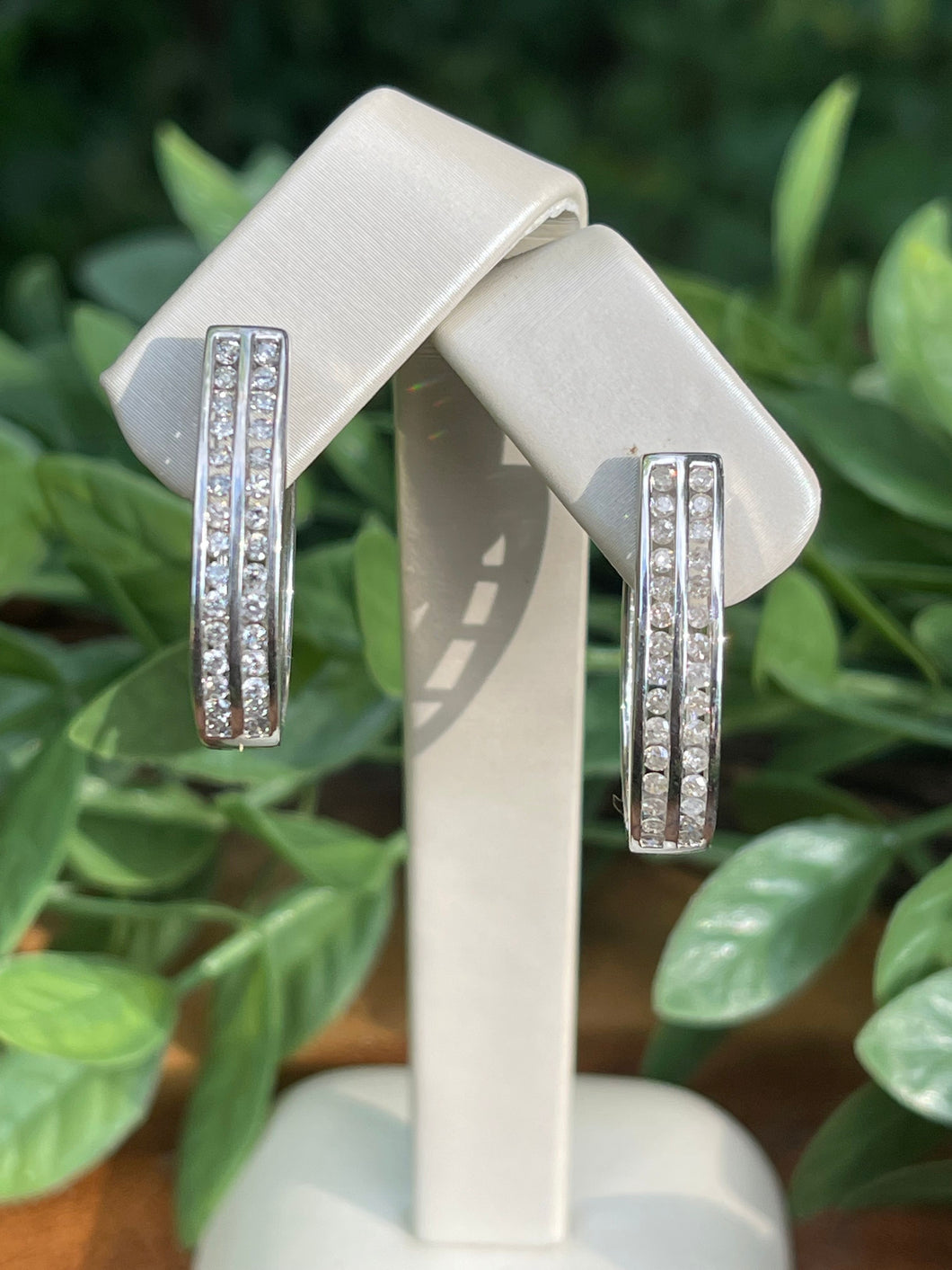 Sterling silver diamond hoop earrings. 1.0 double row channel set